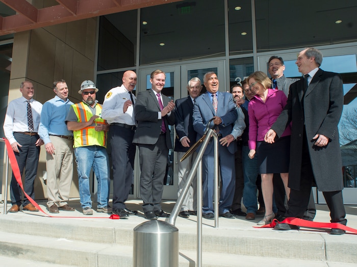 (Rick Egan  |  The Salt Lake Tribune)    County officials cut the ribbon along with Sim Gill, Salt Lake County District Attorney, at the new Salt Lake County District Attorney building in Salt Lake City, Friday, March 9, 2018.


