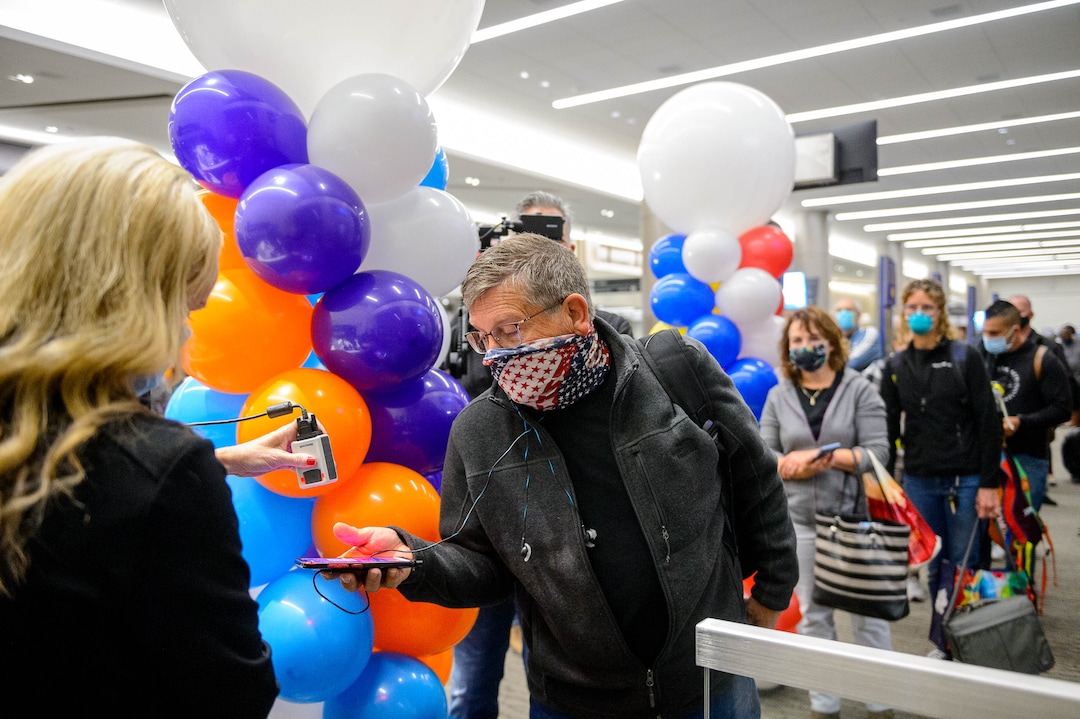 (Trent Nelson  |  The Salt Lake Tribune) Southwest Airlines' Holly Davies checks in passengers for the first flight out of concourse B at the Salt Lake City International Airport on Tuesday, Oct. 27, 2020.