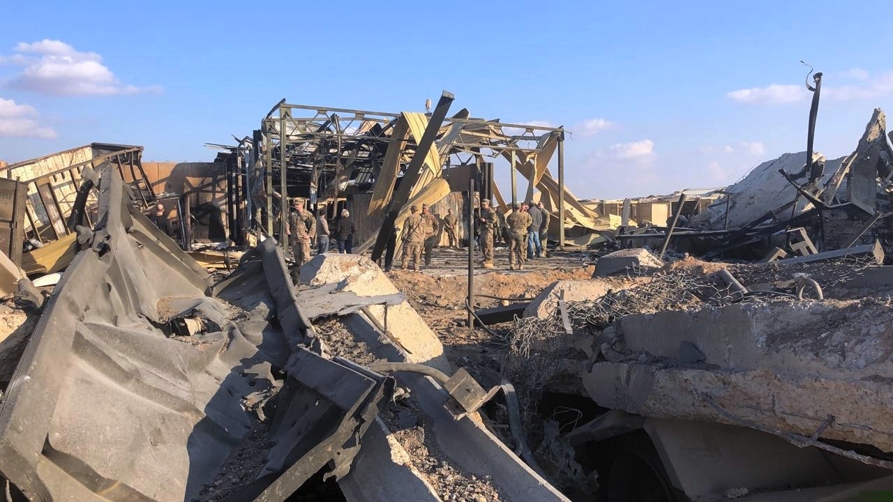(Qassim Abdul-Zahra | AP) U.S. soldiers and journalists inspect the rubble at a site of Iranian bombing, in Ain al-Asad air base, Anbar, Iraq, Monday, Jan. 13, 2020. Ain al-Asad air base was struck by a barrage of Iranian missiles on Wednesday, in retaliation for the U.S. drone strike that killed atop Iranian commander, Gen. Qassem Soleimani, whose killing raised fears of a wider war in the Middle East.