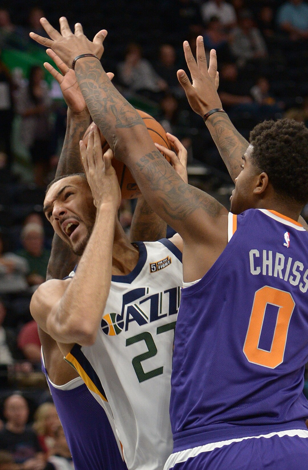 (Leah Hogsten  |  The Salt Lake Tribune)  Utah Jazz center Rudy Gobert (27) fights Phoenix Suns forward Marquese Chriss (0) under the net. The Utah Jazz defeated the Phoenix Suns 112-101 during preseason NBA basketball at Vivint Smart Home Arena in Salt Lake City, October 6, 2017.