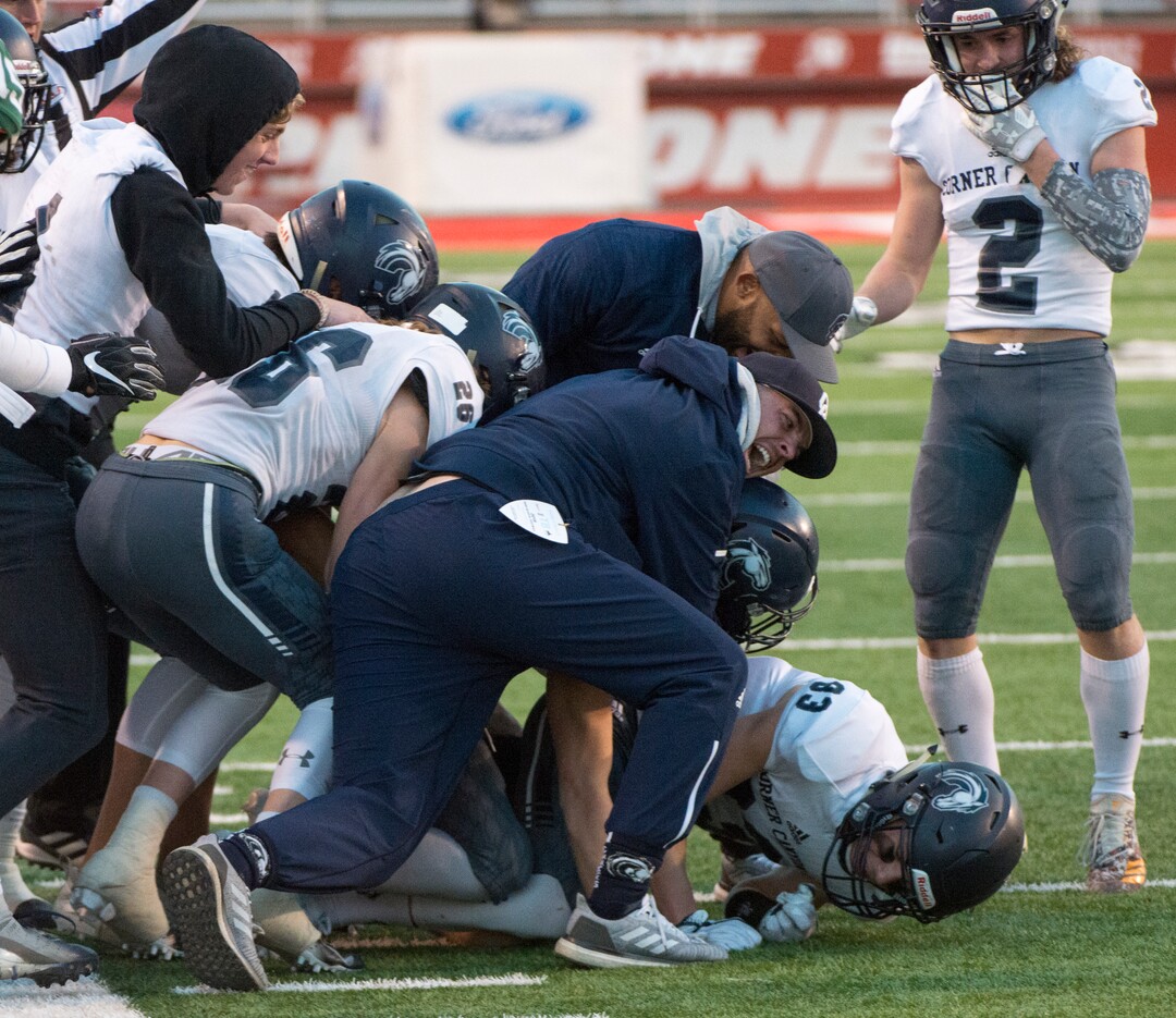 (Rick Egan  |  The Salt Lake Tribune)     Corner Canyon celebrates as defensive back Andrew McDonald intercepts a pass in the final minute of the game to give the Chargers the win over the Olympus Titans, in 5A football semifinal action between Olympus and Corner Canyon at Rice-Eccles Stadium, Thursday, Nov. 8, 2018.