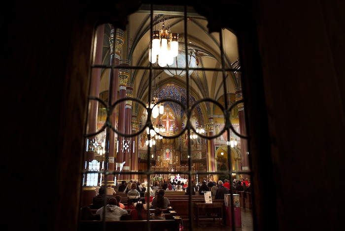(Scott Sommerdorf   |  The Salt Lake Tribune)   Service underway during the early morning Christmas Eve mass on the fourth Sunday of Advent at the Cathedral of the Madeleine, Sunday, December 24, 2017. 