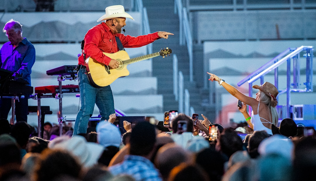 (Isaac Hale | Special to The Tribune) Garth Brooks interacts with fans as he performs with his band during a stop on their stadium tour held at Rice-Eccles Stadium in Salt Lake City on Saturday, July 17, 2021.