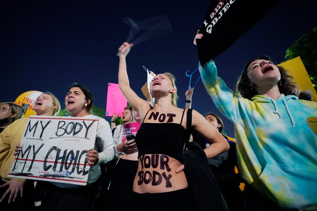 (Alex Brandon | AP) A crowd of people gather outside the Supreme Court, early Tuesday, May 3, 2022 in Washington. A draft opinion circulated among Supreme Court justices suggests that earlier this year a majority of them had thrown support behind overturning the 1973 case Roe v. Wade that legalized abortion nationwide, according to a report published Monday night in Politico. It's unclear if the draft represents the court's final word on the matter. The Associated Press could not immediately confirm the authenticity of the draft Politico posted, which if verified marks a shocking revelation of the high court's secretive deliberation process, particularly before a case is formally decided.