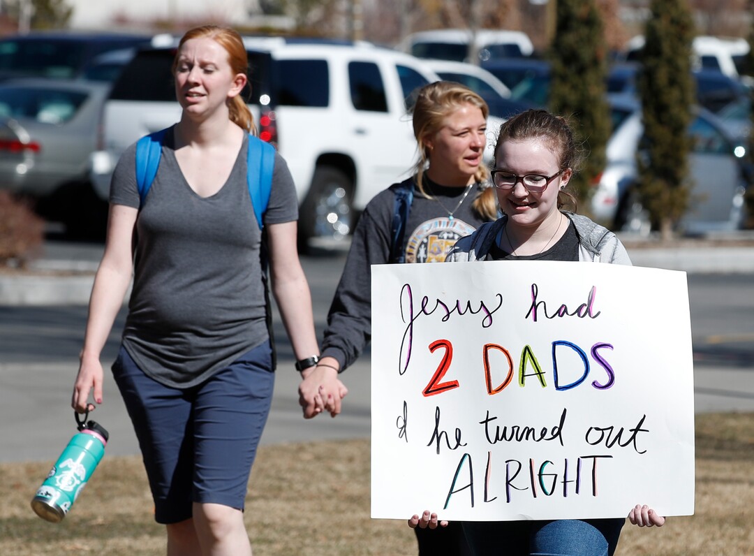 (George Frey  |  special to The Salt Lake Tribune) BYU students and others gather in front of the Ernest L. Wilkinson Student Center on the campus of Brigham Young University to protest BYUÕs rollback of a newly announced policy change on LGBTQ students on March 5, 2020 in Provo, Utah.