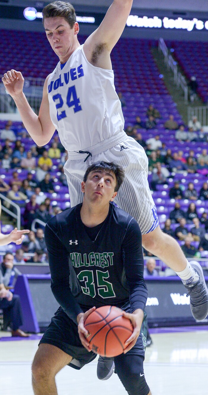 (Leah Hogsten  |  The Salt Lake Tribune) Fremont's Kyler Bush (24) goes over the back of Hillcrest's Mo Saif (35). Fremont faces Hillcrest in the 6A High School Boys' Basketball Tournament opening game at Weber State University’s Dee Events Center in Ogden, Tuesday, Feb. 27, 2018. 