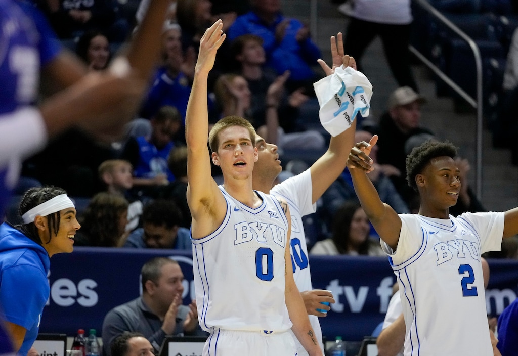 (Bethany Baker  |  The Salt Lake Tribune) Brigham Young Cougars react from the bench as BYU hosts Georgia State in NCAA basketball in Provo on Saturday, Dec. 16, 2023.