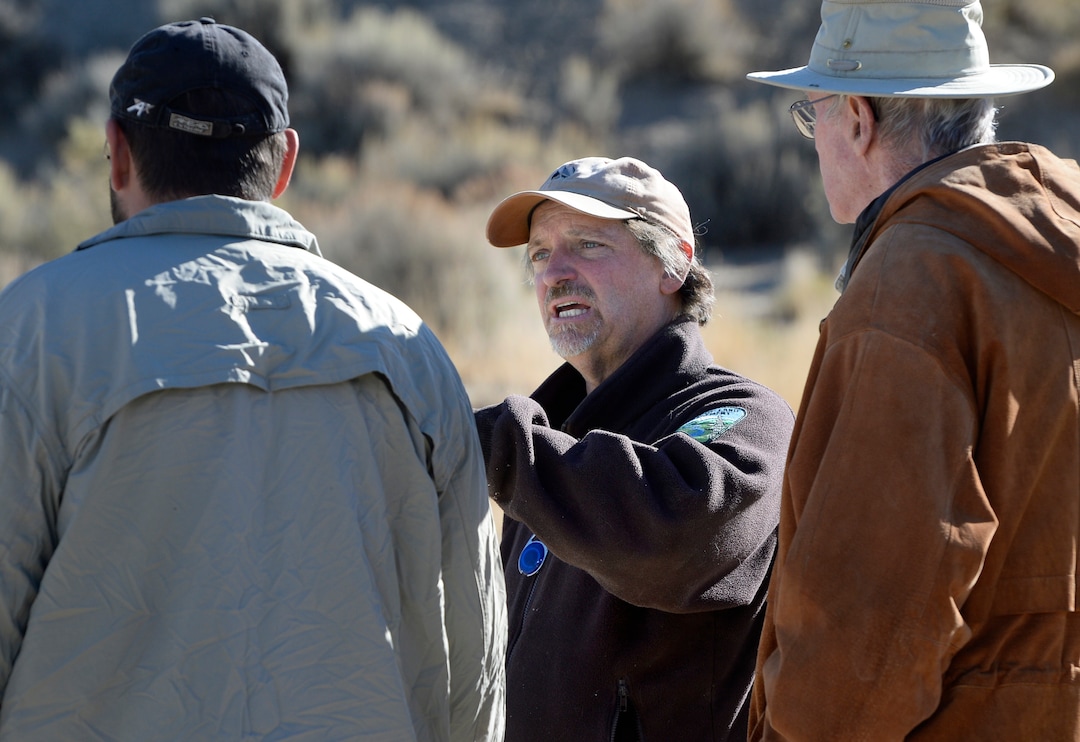 (Scott Sommerdorf   |  The Salt Lake Tribune)   BLM Paleontologist Alan Titus, center, speaks with Taylor Birthisel, left as they discuss the transport the collected skeleton of a T-Rex from near Tropic, Utah, Sunday, October 15, 2017. 
