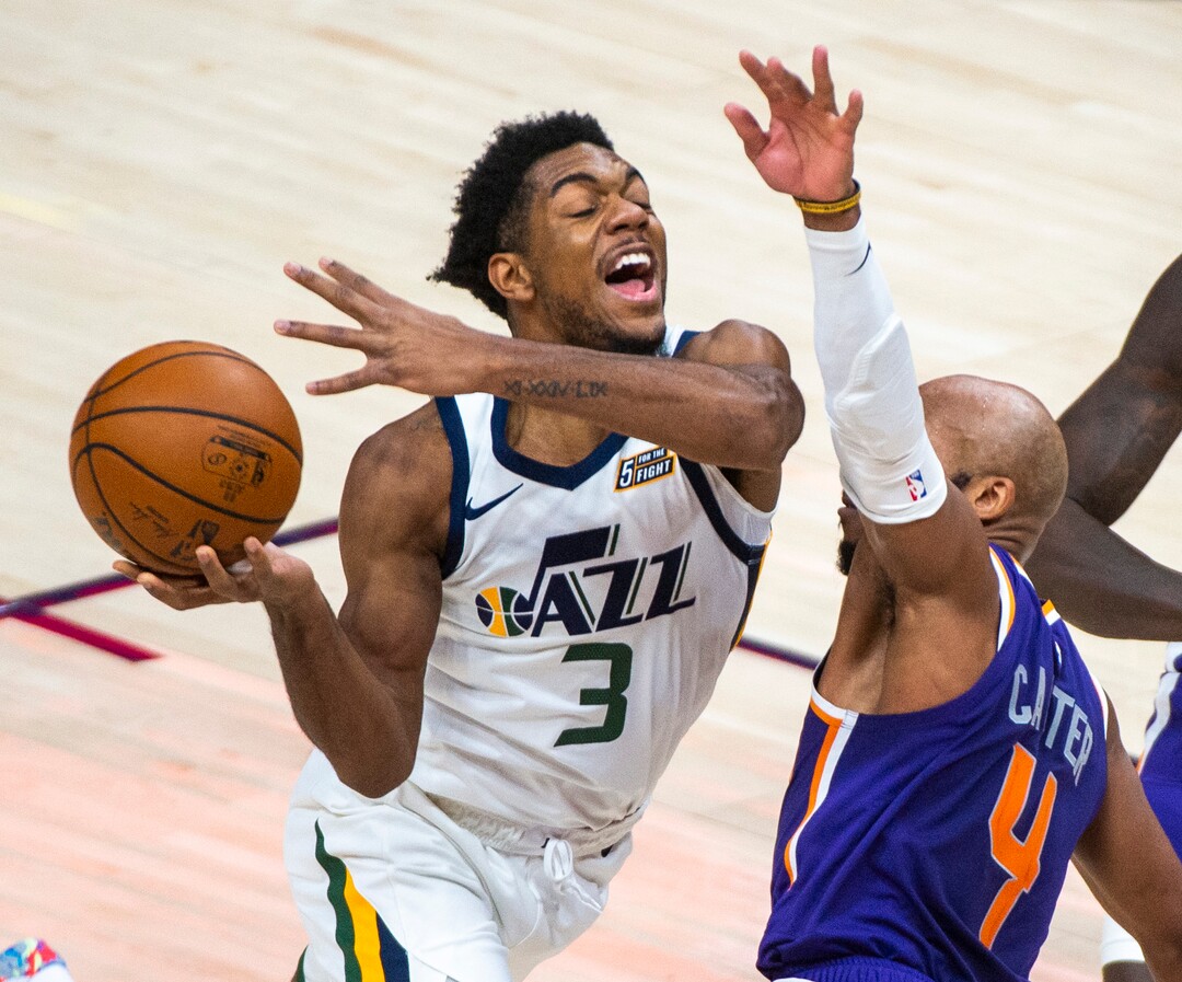 (Rick Egan | The Salt Lake Tribune)  Utah Jazz guard Justin Wright-Foreman (3) collides with Phoenix Suns guard Jevon Carter (4), in preseason NBA action between Utah Jazz and Phoenix Suns at Vivint SmartHome Area, on Saturday, Dec. 12, 2020.
