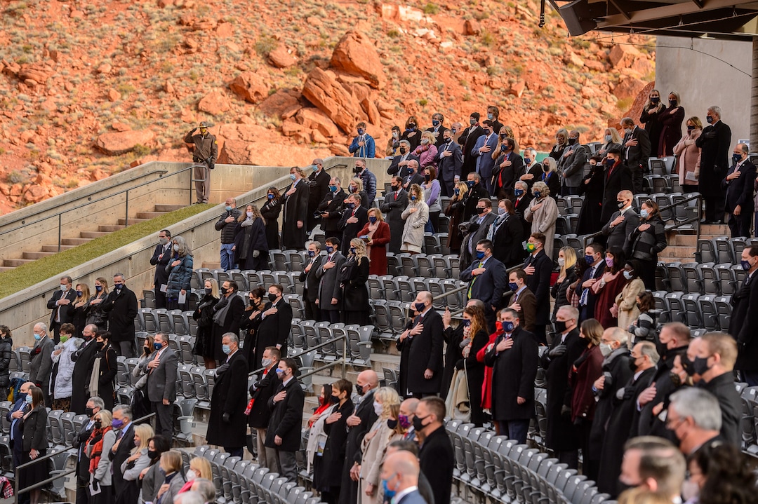 (Trent Nelson  |  The Salt Lake Tribune) Attendees stand for the National Anthem as Spencer Cox is inaugurated as Utah's 18th governor at Tuacahn Center for the Arts in Ivins on Monday, Jan. 4, 2021.