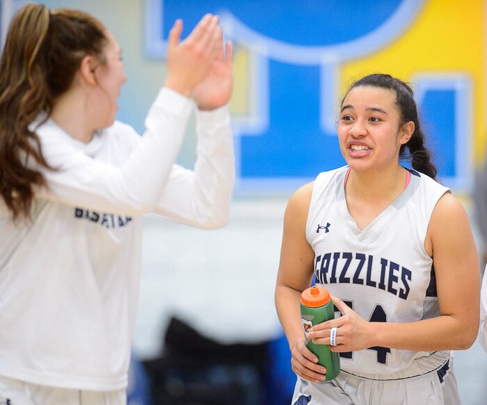 (Trent Nelson | The Salt Lake Tribune)  Copper Hills's Laci Olsen (24) and other players celebrate after the final buzzer as Layton faces Copper Hills in the 6A High School Girls' Basketball Tournament at SLCC in Taylorsville, Thursday Feb. 22, 2018.