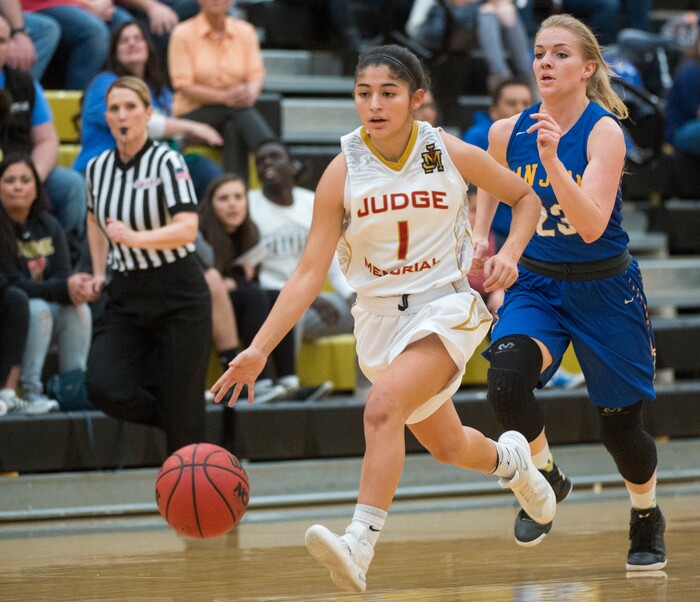 (Rick Egan  |  The Salt Lake Tribune)   San Juan guard Ryan Shumway (30) chases Emily Garcia (1) Judge Memorial,  as she leads a fast break, in 3A Women's basketball State playoff action Judge Memorial vs. San Juan, in Heber City, Friday, Feb. 16, 2018.