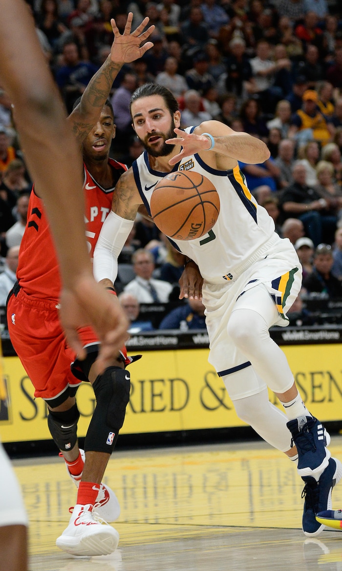 (Francisco Kjolseth  |  The Salt Lake Tribune)  Utah Jazz guard Ricky Rubio (3) tries to push past Toronto Raptors guard Delon Wright (55) in the first half of the preseason NBA game at Vivint Smart Home Arena Tuesday, Oct. 2, 2018, in Salt Lake City.