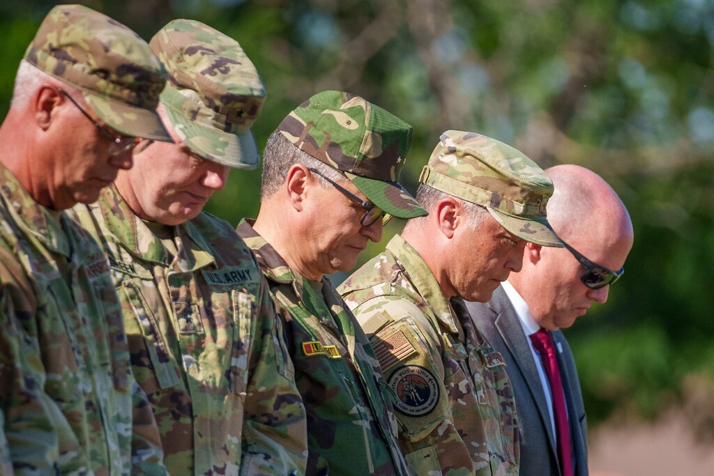 (Trent Nelson  |  The Salt Lake Tribune) Royal Moroccan Armed Forces General de Brigade Aziz Idriss Yazami (center), Utah Adjutant General Brig. Gen. Daniel Boyack and Gov. Spencer Cox observe a moment of silence for fallen service members during the Utah National Guard Governor's Day at Camp Williams on Saturday, Sept. 9, 2023.