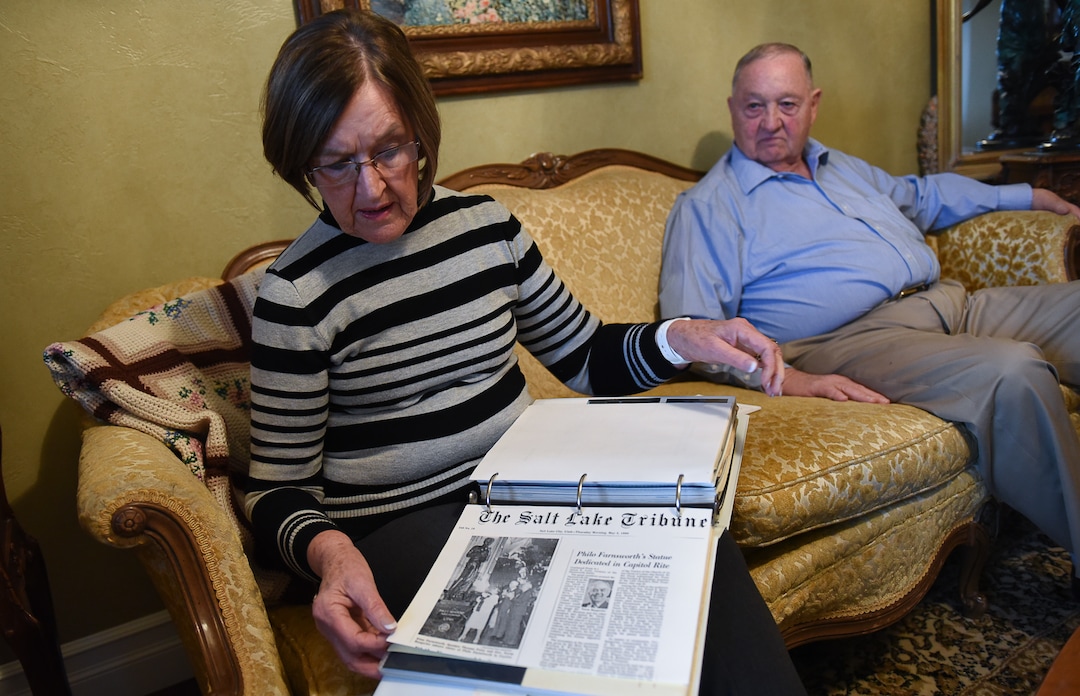 (Francisco Kjolseth  |  The Salt Lake Tribune)  Treva and Bruce Barnson of Draper, look through memorabilia of their involvement in recognizing Utah inventor who made the first TV transmission, Philo T. Farnsworth. Bruce Barnson, a former principal of Ridgecrest Elementary, lobbied the Legislature back in the late 80s to bring the larger than life statue to Statuary Hall in Washington D.C., and is making the argument to keep it where it is. Sen. Todd Weiler has introduced a bill for January's legislative session to replace Farnsworth's statue with Martha Hughes Cannon, the first woman state senator.