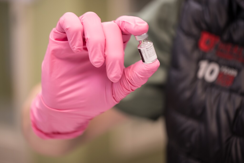 (Courtesy University of Utah Health) A University of Utah Health employee holds a vial of the Pfizer COVID-19 vaccine.
