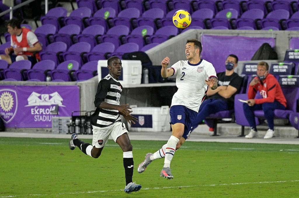 (Phelan M. Ebenhack | AP) United States defender Aaron Herrera (2) heads the ball in front of Trinidad and Tobago forward Jabari Mitchell (11) during the second half of an international friendly soccer match, Sunday, Jan. 31, 2021, in Orlando, Fla.