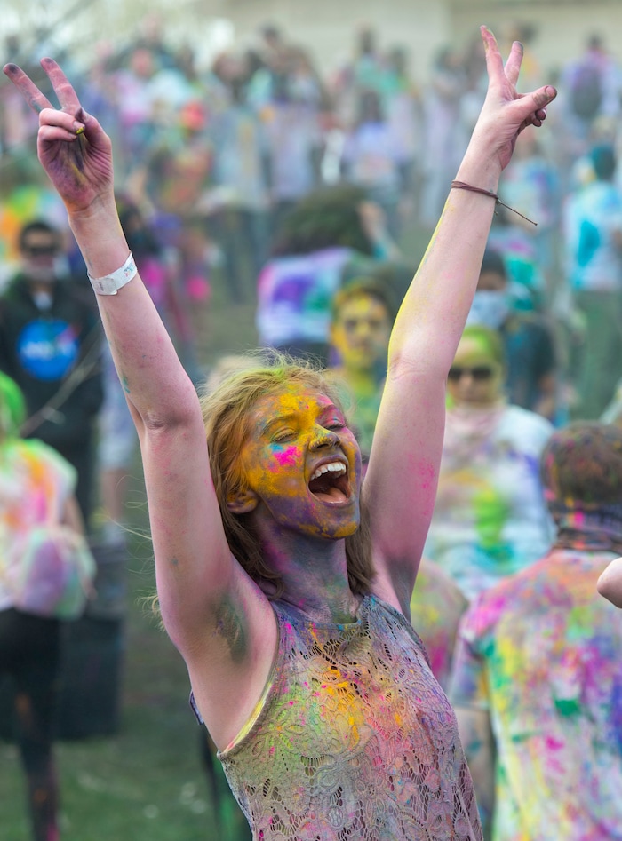 (Rick Egan  |  The Salt Lake Tribune)   Adalaide Bailey, from Pocatello Idaho cheers along with the band, during the Holi Festival of Colors celebration at the Sri Sri Radha Krishna Temple in Spanish Fork, Saturday, March 30, 2019.
 
