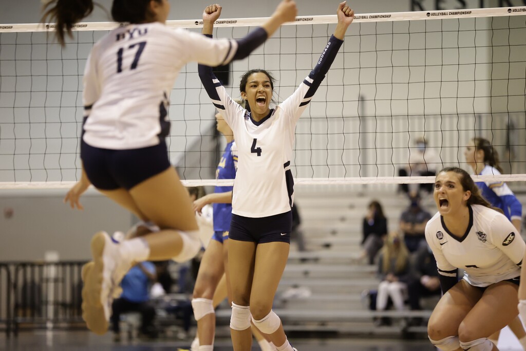 (Jaren Wilkey | BYU Athletics) Leilani Dodson (4) celebrates with her team following their first set win, 26-24.