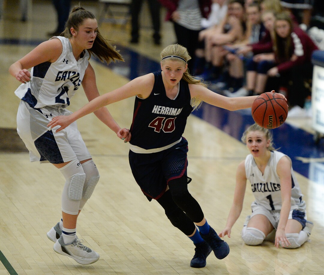 (Francisco Kjolseth  |  The Salt Lake Tribune)  Herriman's Courtney Taylor splits the Copper Hills defense after a steal in game action in West Jordan on Thursday, Jan. 25, 2018.
