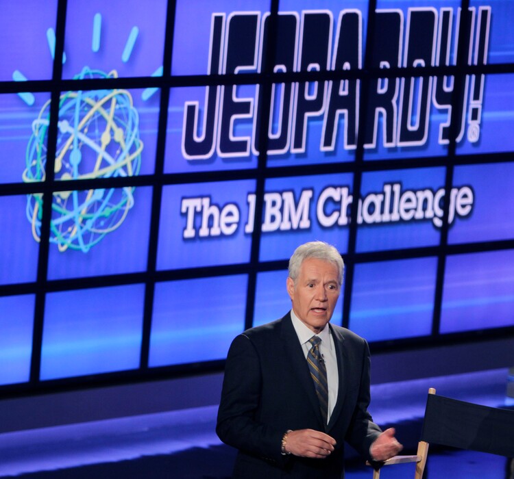 (Seth Wenig  |  AP file photo) In this Jan. 13, 2011, file photo, Alex Trebek, host of the "Jeopardy!" quiz show, speaks to an audience of primarily media about an upcoming "Jeopardy!" show featuring IBM's "Watson" in Yorktown Heights, N.Y. New York City bartender Austin Rogers extended his run of wins to eight on the show that aired Oct. 5, 2017, and boosted his total winnings to more than $300,000. Rogers' on-screen antics are winning him a cult following.