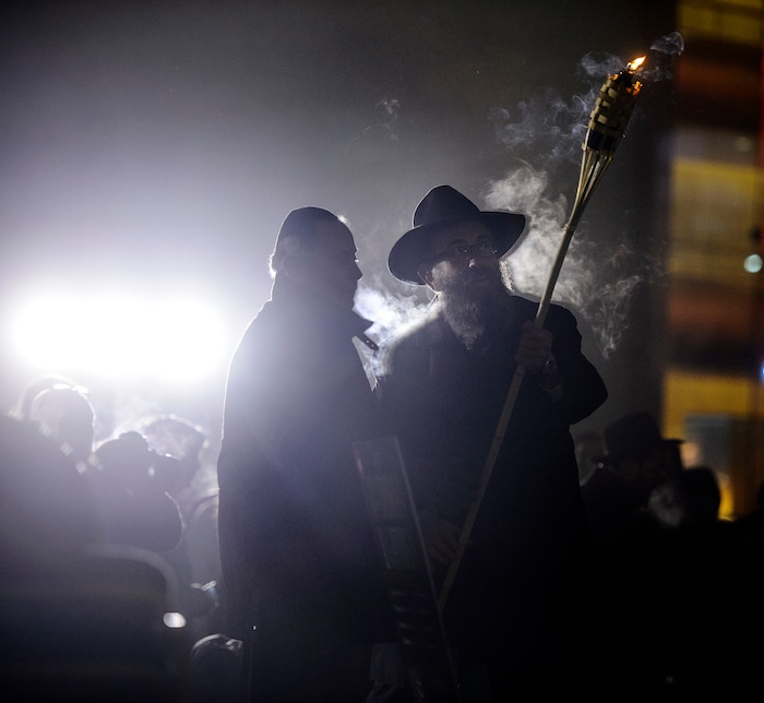 (Steve Griffin  |  The Salt Lake Tribune)   Rabbi Benny Zippel of Chabad Lubavitch is joined by John Price as they prepare to light a giant menorah for the first night of Hanukkah, the Jewish eight day festival of lights outside, Abravanel Hall in Salt Lake City Tuesday December 12, 2017.