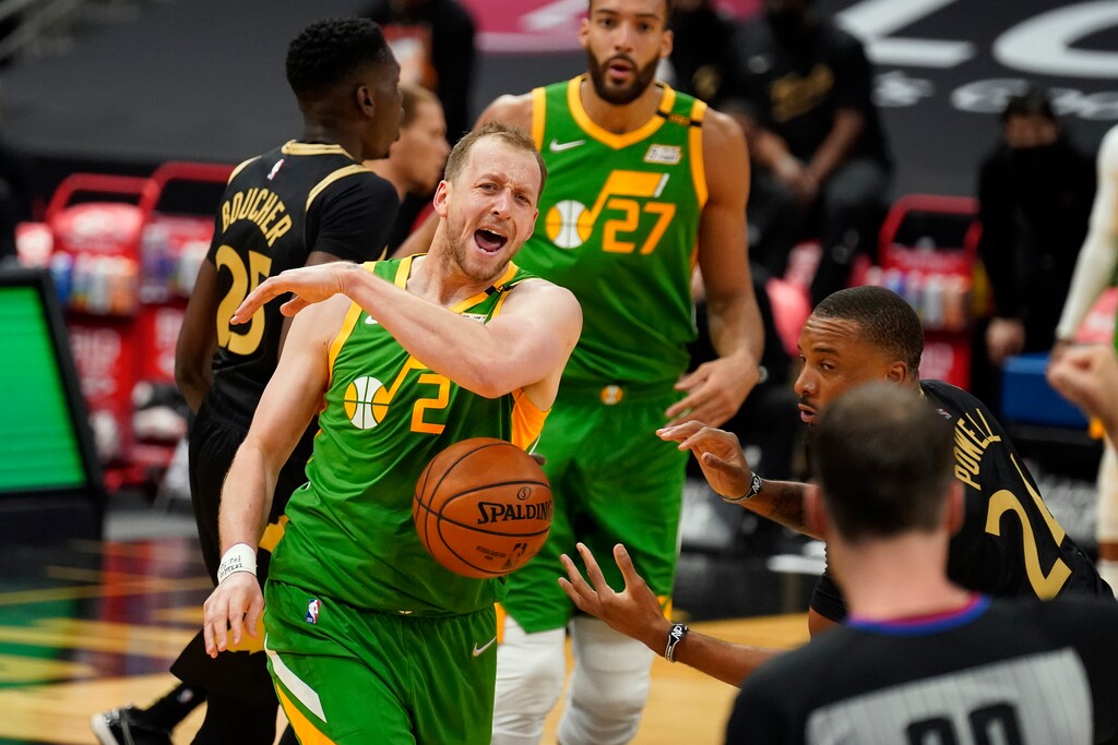 Utah Jazz guard Joe Ingles (2) shouts at an official after getting fouled by Toronto Raptors forward Norman Powell (24) during the first half of an NBA basketball game Friday, March 19, 2021, in Tampa, Fla. (AP Photo/Chris O'Meara)