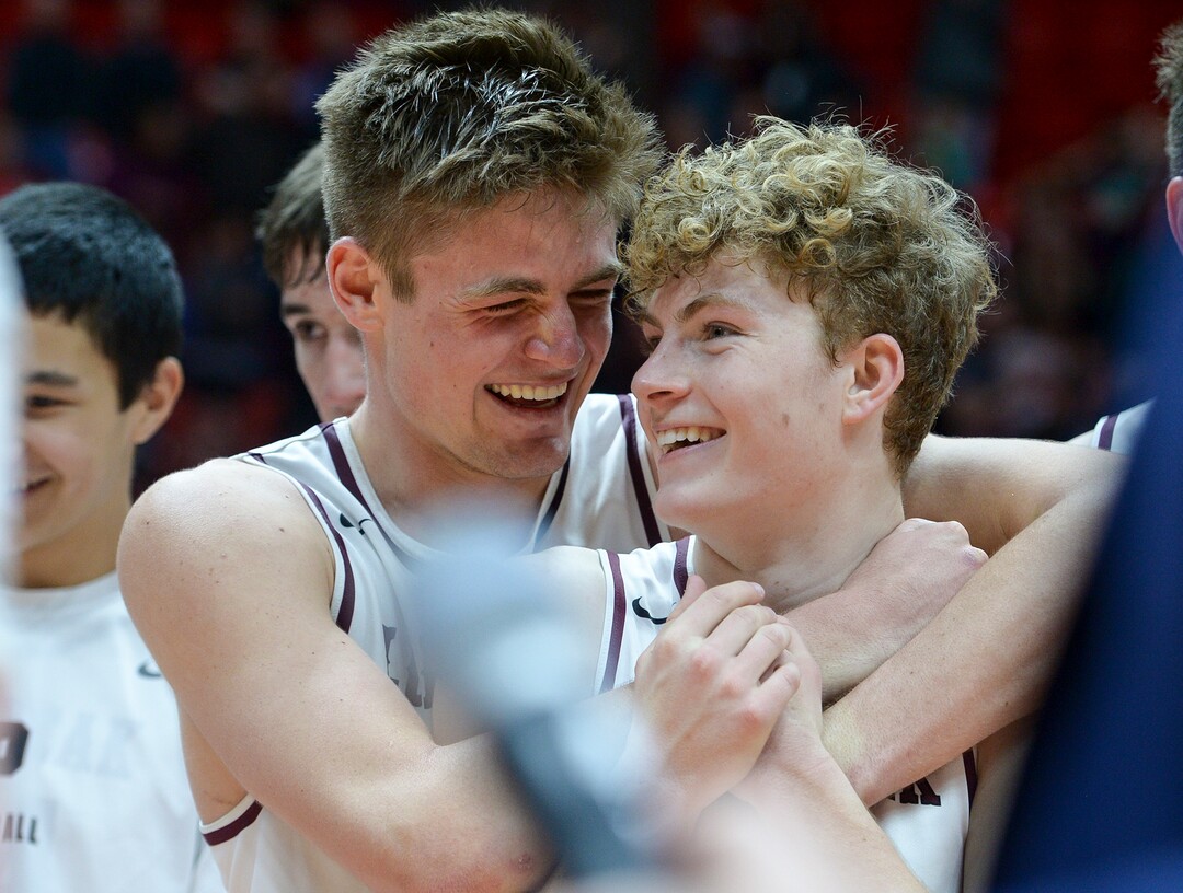 (Leah Hogsten  |  The Salt Lake Tribune) Lone Peak's Taylor Madson (32) celebrates the win with Lone Peak's Max Brenchley (01). Lone Peak defeated Pleasant Grove 61-44 to win the 6A High School BoysÕ Basketball Tournament Championship at the Jon M. Huntsman Center in Salt Lake City, Saturday, March 3, 2018. 
