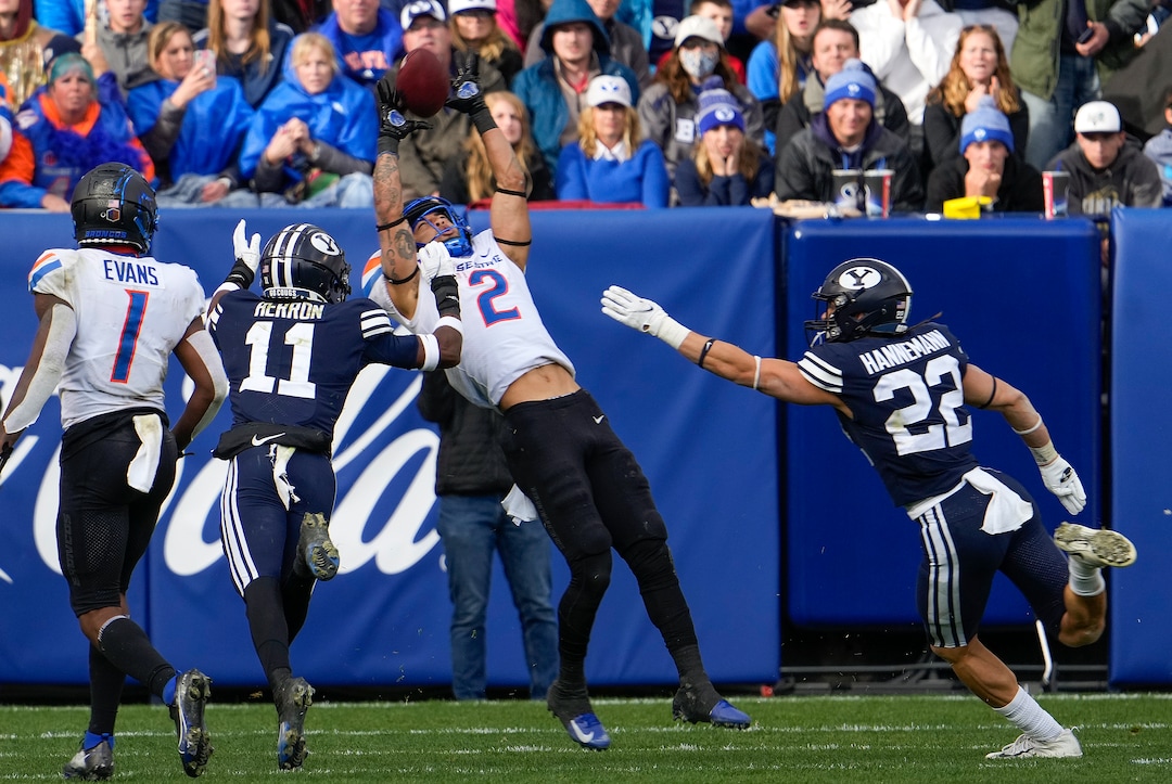 (Leah Hogsten | The Salt Lake Tribune) Boise State Broncos wide receiver Khalil Shakir (2) pulls down the pass past Brigham Young Cougars defensive back Isaiah Herron (11) as No. 10 Brigham Young University hosts Boise State at LaVell Edwards Stadium, Oct. 9, 2021.