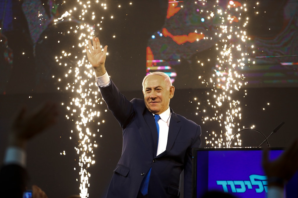 Israel's Prime Minister Benjamin Netanyahu waves to his supporters after polls for Israel's general elections closed in Tel Aviv, Israel, Wednesday, April 10, 2019. (AP Photo/Ariel Schalit)