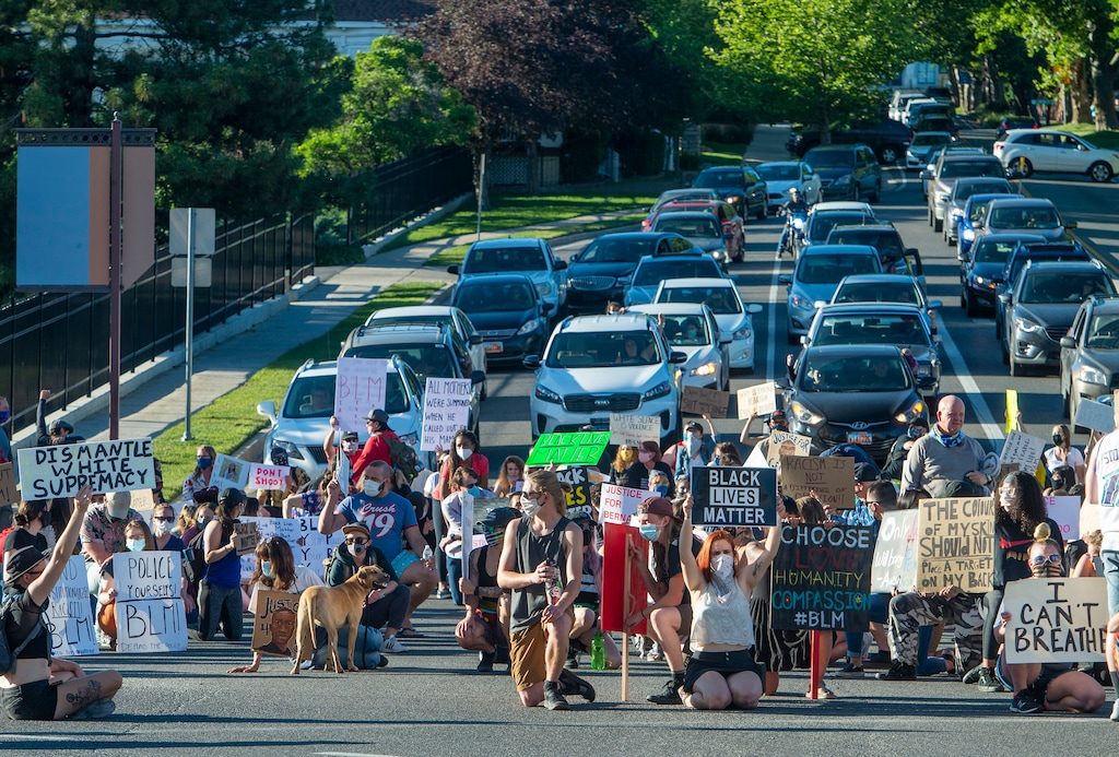 (Rick Egan | The Salt Lake Tribune) Protesters block traffic on North Temple and State Street from the State Capitol, Wednesday, June 10, 2020.
