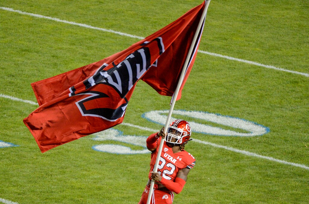 (Chris Samuels | The Salt Lake Tribune) Utah Utes cornerback Aaron Lowe waves a Ty Jordan memorial flag before the Utes play the Brigham Young Cougars in football, Saturday, Sept. 11, 2021 in Provo. Lowe was shot and killed at a Salt Lake City party Sunday, Sept. 26, 2021.