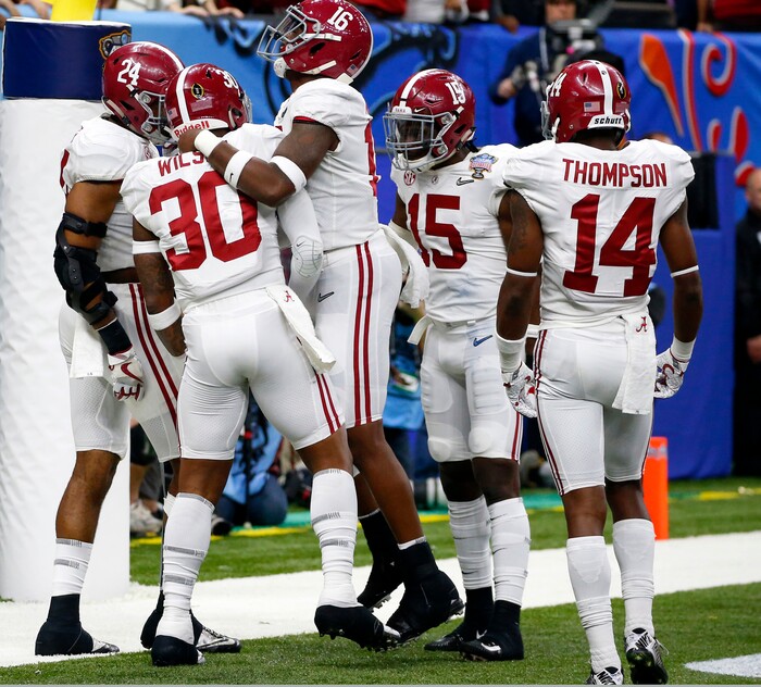 Alabama linebacker Mack Wilson (30) celebrates with teammates after returning an interception for a touchdown in the second half of the Sugar Bowl semi-final playoff game against Clemson for the NCAA college football national championship, in New Orleans, Monday, Jan. 1, 2018. (AP Photo/Butch Dill)