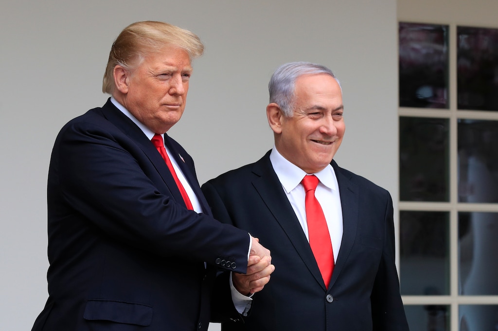 FILE - In this March 25, 2019 file photo, President Donald Trump welcomes visiting Israeli Prime Minister Benjamin Netanyahu to the White House in Washington. In the eyes of critics, Benjamin Netanyahu’s decision to bar two Democratic congresswomen at the request of President Donald Trump is the latest reckless gamble by a prime minister willing to sacrifice Israel’s national interests for short-term gain. And yet the pursuit of such allegedly short-term gains has kept Netanyahu in power for more than a decade. (AP Photo/Manuel Balce Ceneta, File)