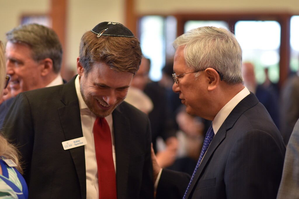 (Michael Stack | Special to The Tribune) Rabbi Samuel Spector, left, and Latter-day Saint apostle Gerrit W. Gong chat at the 50th anniversary celebration of the founding of Congregation Kol Ami in Salt Lake City on May 7, 2023.