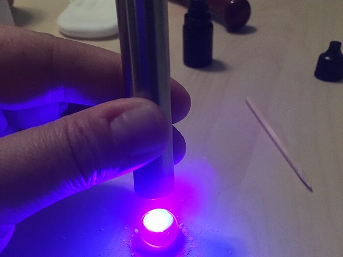 (Marina Gomberg | The Salt Lake Tribune) Marina made a necklace out of her breast milk. She knows that's weird, but she loves it because she thinks breast milk is amazing. Step 6: Seal powder in pendant with drops of glue and a couple minutes of the blue light.