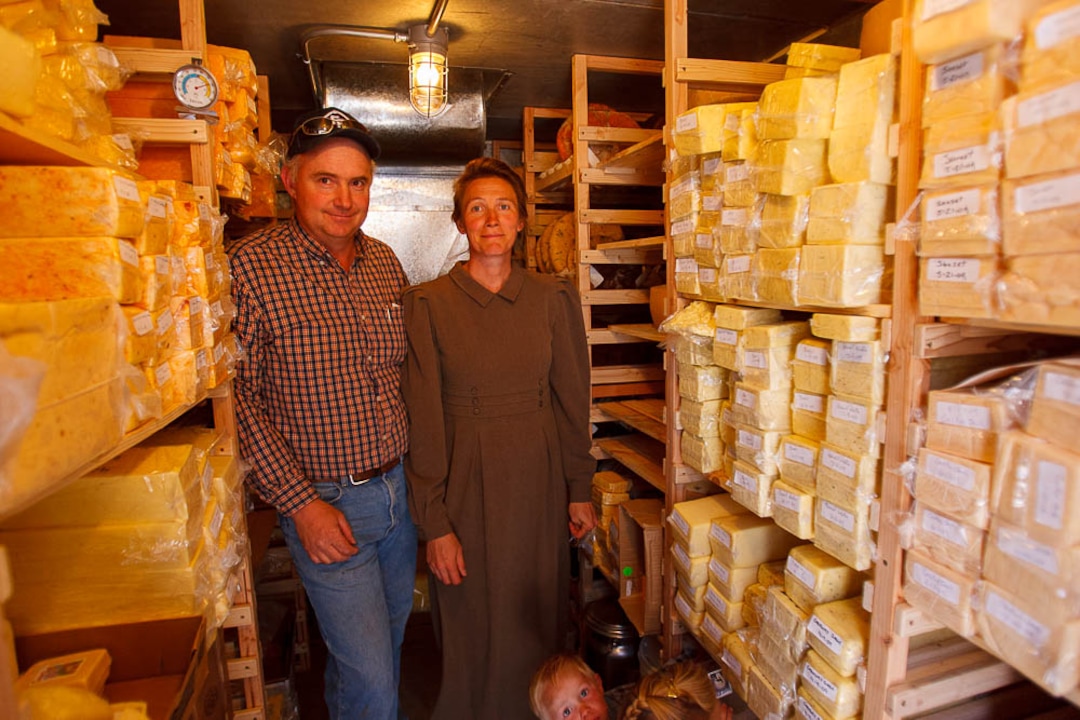 (Trent Nelson  |  The Salt Lake Tribune) Winford and Carolena Barlow in the cheese cold storage room at Finney Farm in Hildale on Tuesday August 11, 2009.
