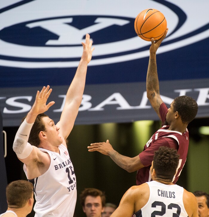 (Rick Egan  |  The Salt Lake Tribune)   Texas Southern Tigers forward Lamont Walker (14) takes a shot, as  Brigham Young Cougars forward Payton Dastrup (15) defends, in basketball action, Brigham Young Cougars vs Texas Southern Tigers, at the Marriott Center in Provo, Saturday, December 23, 2017.