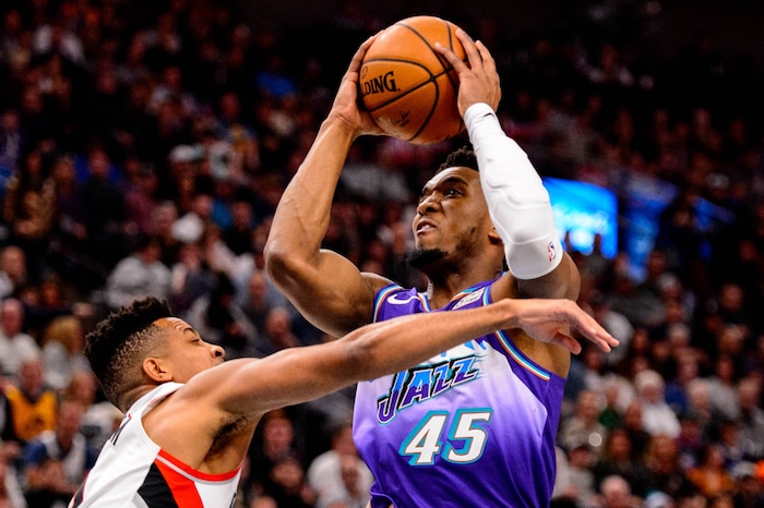 (Trent Nelson  |  The Salt Lake Tribune) Utah Jazz guard Donovan Mitchell (45) shoots as the Utah Jazz host the Portland Trail Blazers, NBA basketball in Salt Lake City on Thursday, Dec. 26, 2019.