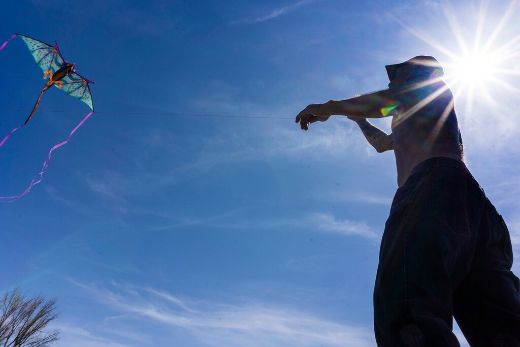 (Rick Egan | The Salt Lake Tribune) Greg takes advantage of a spring breeze as he flies his dragon kite at Liberty Park, on Friday, April 23, 2021. Salt Lake City temperatures could reach the 60s on Wednesday and Thursday, followed by possible snow in the weekend forecast.