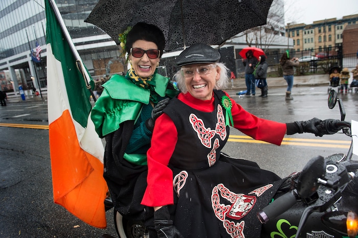 Scott Sommerdorf | The Salt Lake Tribune
Gina Gottfredson gives her mother Clyde Gottfredson a ride on her motorcycle during the 40th annual Salt Lake City St. PatrickÕs Day Parade, Saturday, March 17, 2018. Gina was longtime teacher of the McTeggart Irish Dancers here in SLC and Clyde used to march in front of them carrying an Irish flag.