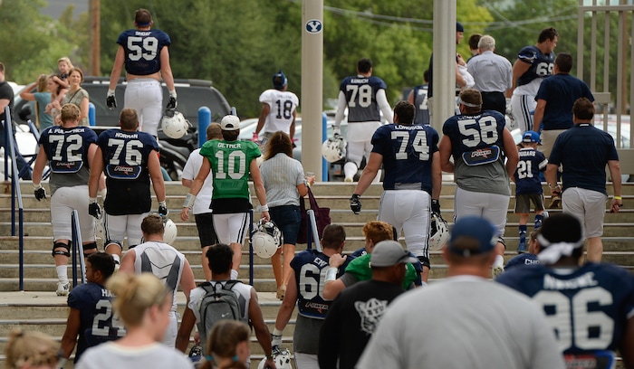(Francisco Kjolseth  |  The Salt Lake Tribune)  BYU fans and players wrap up a scrimmage at LaVell Edwards Stadium in Provo on Thursday, Aug. 10, 2017.