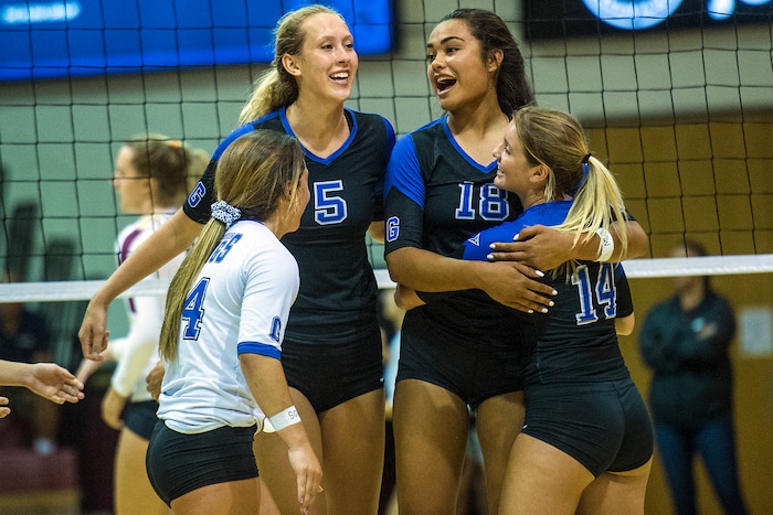 (Chris Detrick  |  The Salt Lake Tribune)  Pleasant Grove's Heather Gneiting (5) celebrates winning a point with her teammates Pleasant Grove's Megan Sintay (18) Pleasant Grove's Alia Rasmussen (4) and Pleasant Grove's Baylie Bishop (14) during the volleyball match at Lone Peak High School Tuesday, September 5, 2017. 