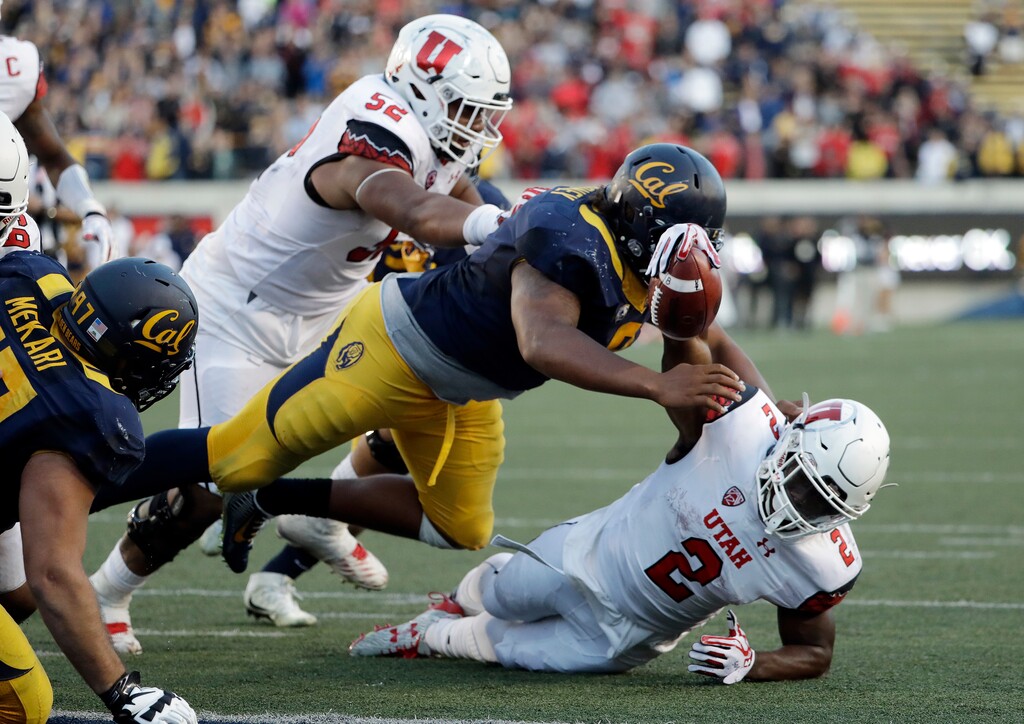 (AP Photo/Marcio Jose Sanchez) Utah running back Zack Moss (2) is stopped just shy of the end zone by California defensive tackle James Looney, top, on the last play Oct. 1, 2016, in Berkeley, Calif. California won 28-23.