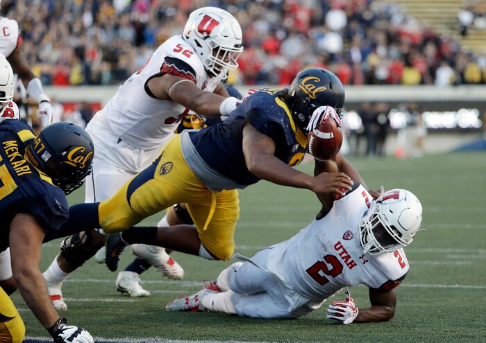 Utah running back Zack Moss (2) is stopped just shy of the end zone by California defensive tackle James Looney, top, on the last play of an NCAA college football game Saturday, Oct. 1, 2016, in Berkeley, Calif. California won 28-23. (AP Photo/Marcio Jose Sanchez)