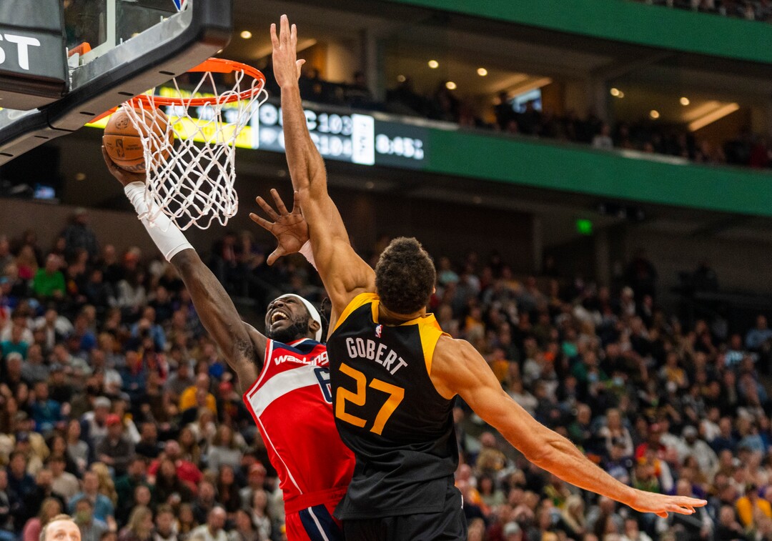 (Rick Egan | The Salt Lake Tribune) Washington Wizards center Montrezl Harrell (6) goes to the hoop, as Utah Jazz center Rudy Gobert (27) defends, in NBA action between the Utah Jazz and the Washington Wizards, at Vivint Arena on Saturday, Dec. 18, 2021.