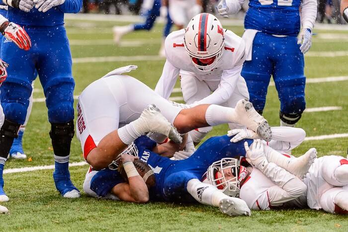 (Trent Nelson | The Salt Lake Tribune)  Bingham's Braedon Wissler (1) is brought down as East faces Bingham in the Class 6A High School State Football Championship game in Salt Lake City, Friday November 17, 2017.