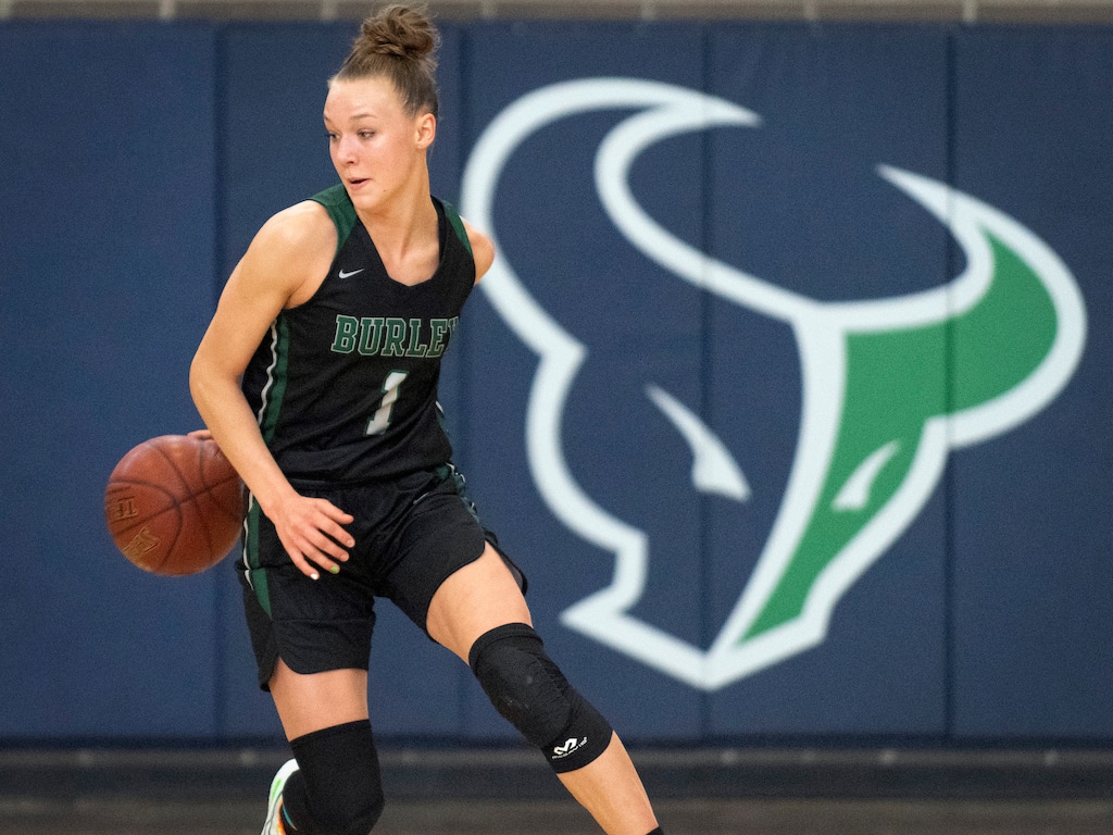 (Drew Nash | Times-News/Magicvalley.com) Burley High School's Amari Whiting dribbles behind her back during the Idaho state girls 4A championships on Saturday, Feb. 20, 2021, at Mountain View High School in Meridian, Idaho.