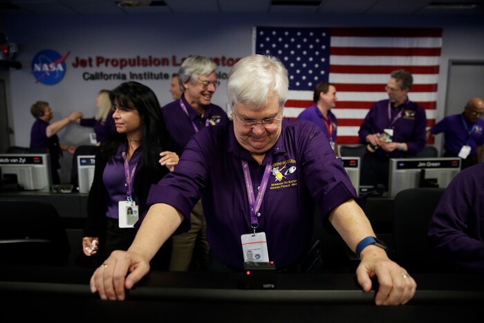 Flight director Julie Webster gets emotional in mission control at NASA's Jet Propulsion Laboratory after confirmation of Cassini's demise Friday, Sept. 15, 2017, in Pasadena, Calif. Cassini disintegrated in the skies above Saturn early Friday, following a remarkable journey of 20 years. (AP Photo/Jae C. Hong, Pool)