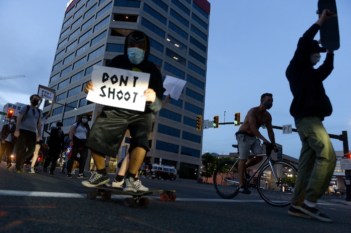 (Leah Hogsten  |  The Salt Lake Tribune) Protesters walk down State Street against police brutality in Salt Lake City on Monday, June 1, 2020.
